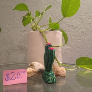 This is a wooden cactus with beads